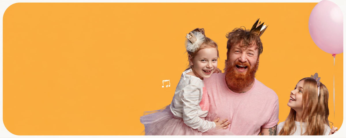 A festive birthday scene with a bearded man in a pink shirt and gold crown holding a young girl in a pink tutu, with another girl looking on, set against a solid orange background with a pink balloon.