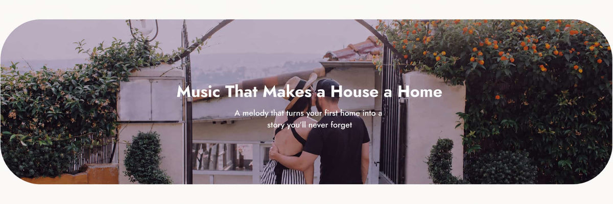 A banner-style promotional image with a couple embracing in front of a house gate, surrounded by greenery and orange blossoms. White text across the center reads, 'Music That Makes a House a Home' with smaller tagline text below.