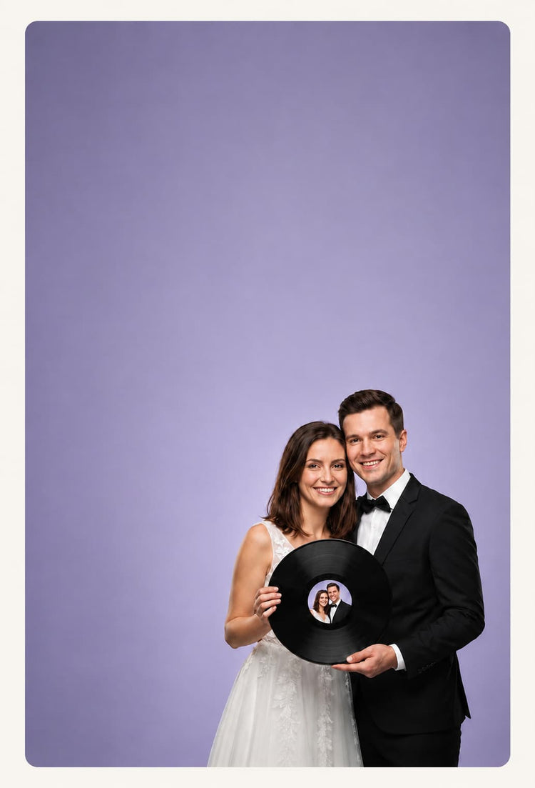 Smiling newlywed couple holding a personalized black vinyl record with their photo on the center label, set against a soft lavender background with a cream border.
